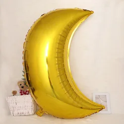 A 36 inch gold silver oversized moon aluminum foil balloon for decorating the Ramadan party