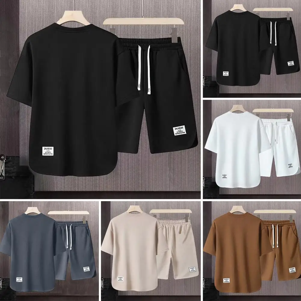 ชุดกีฬาผ้ายืดเอวสูงย้อนยุคชุดออกกำลังกายของผู้ชายเสื้อยืดสีทึบทรงหลวมผสมกับเชือกผูกสำหรับใส่สบาย