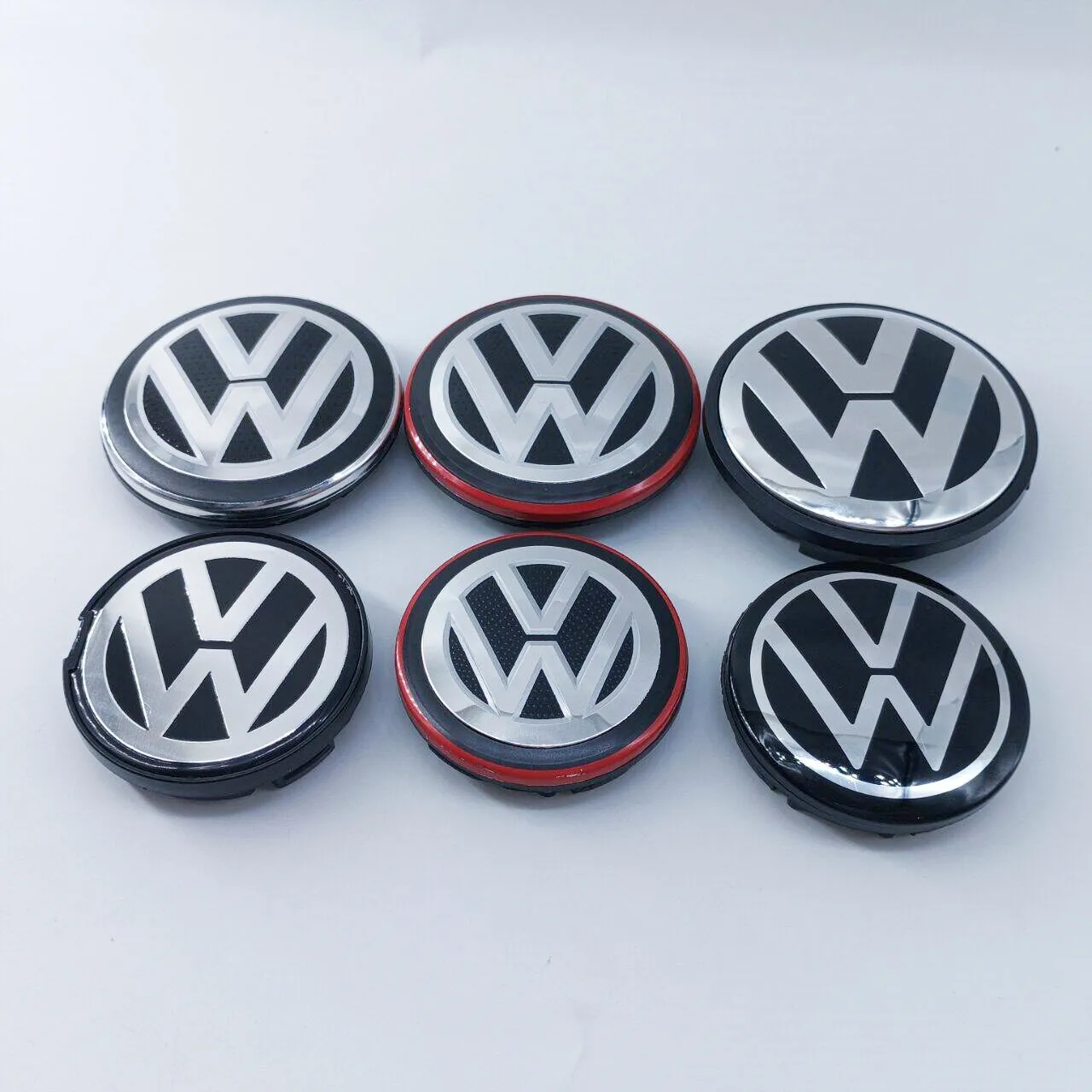 10 Uds. Tapas centrales de rueda Volkswagen, cubiertas de cubo de 50mm-76mm, insignia, accesorios de estilo de coche compatibles con varios modelos