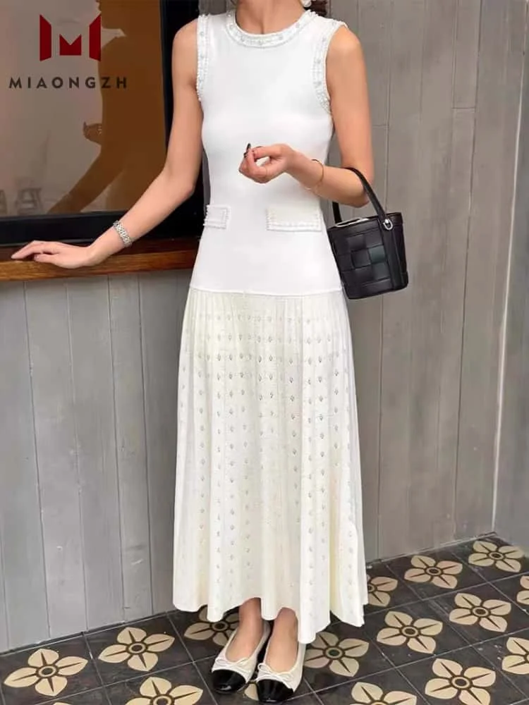 

2025 Early Spring New O Neck Knitted Dress Women's Fashion Hollow Out Sleeveless Pearls Elegant Female Slimming Party Dresses