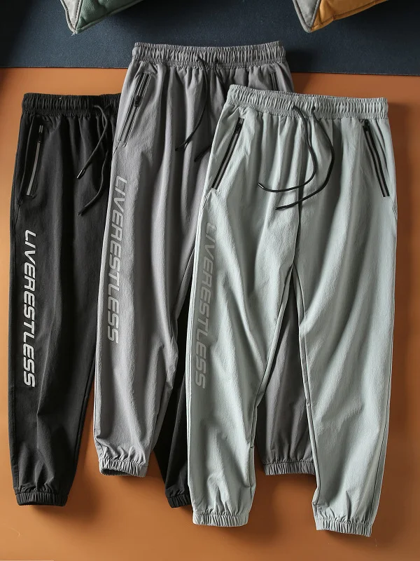 

Spring Summer New Elastic Comfortable Reflective Letter Men's Elastic Waist Sports Casual Pants Qui Dry Sweatpants