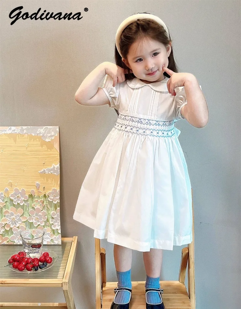 

Sweet Girls Vintage White Smocked Waist Dress 2026 Summer New Handmade Embroidery Peter Pan Collar Short Sleeve Casual Dresses
