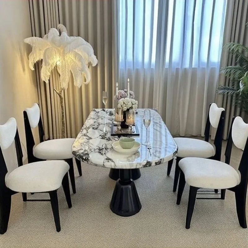

Small apartment Internet celebrity modern simple light luxury Holy Grail dining table oval home matte