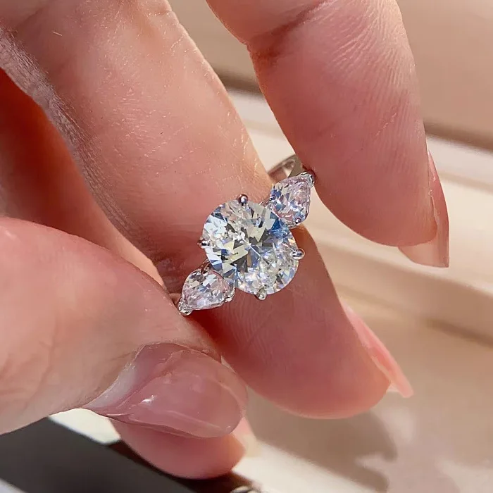 

Oval dove's egg three birthstones light luxury ring women's light luxury high sense of luxury wedding ring proposal wedding diam