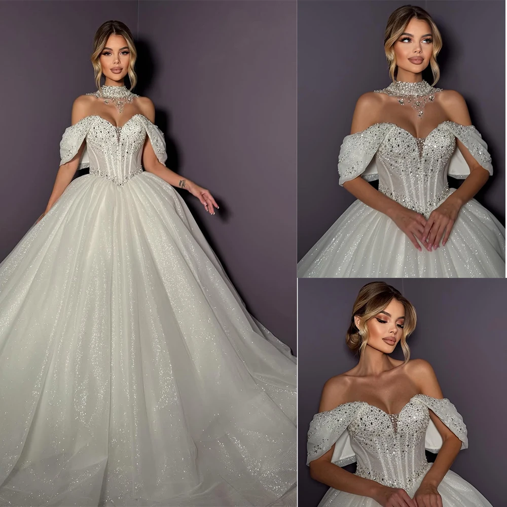 ชุดแต่งงานเจ้าสาวผ้าทูลล์คอวีปักเลื่อมประกายวิบวับสั่งทำพิเศษปี 2026 เวสติโด เดอ โนวาล