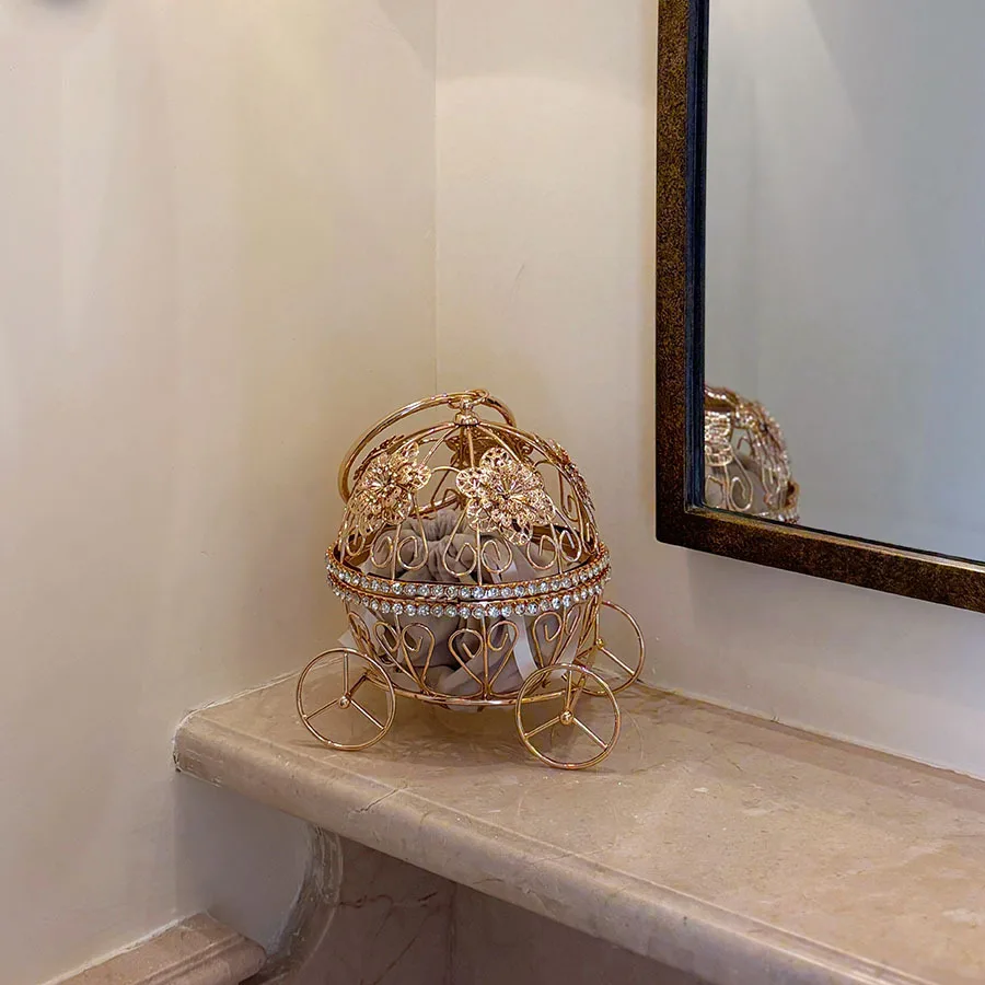 Gilt hollow pumpkin carriage handbag with diamonds and flower ornamentation ring handle heavy industry metal dinner bag
