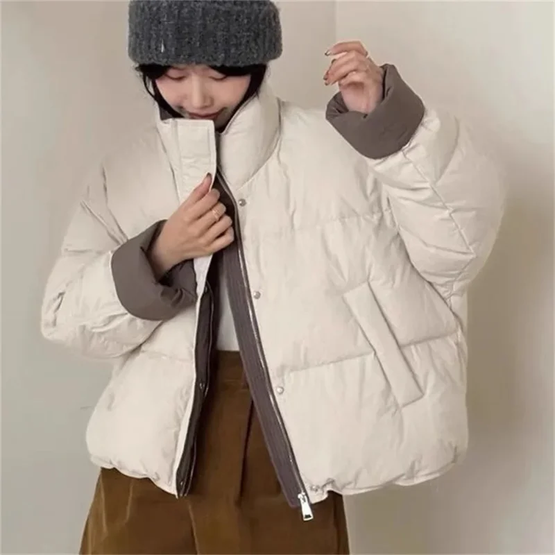 

New Korean style winter cotton-padded coat, color-blocked stand-up collar, short style, loose fit, thick and warm, suitable for