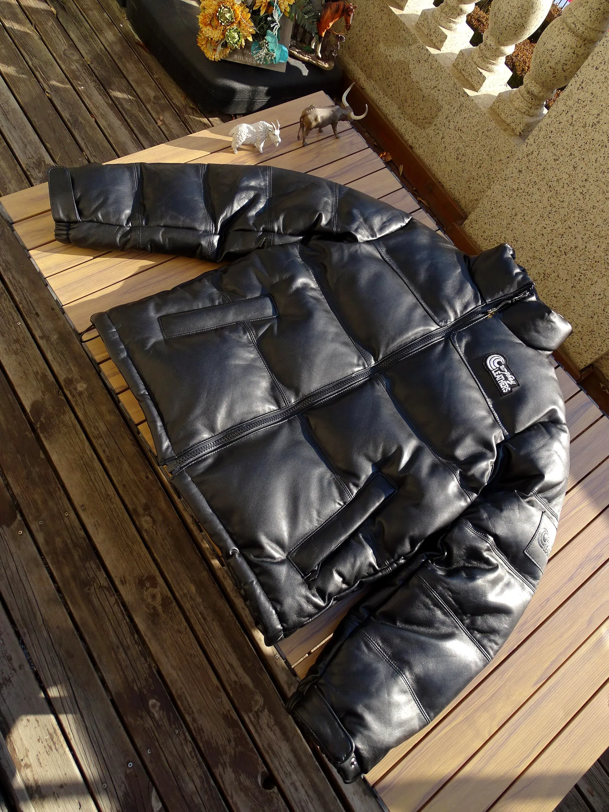 

Кожаное пуховое пальто из натуральной овчины с воротником-стойкой, утепленное, теплое, морозостойкое, с длинными рукавами