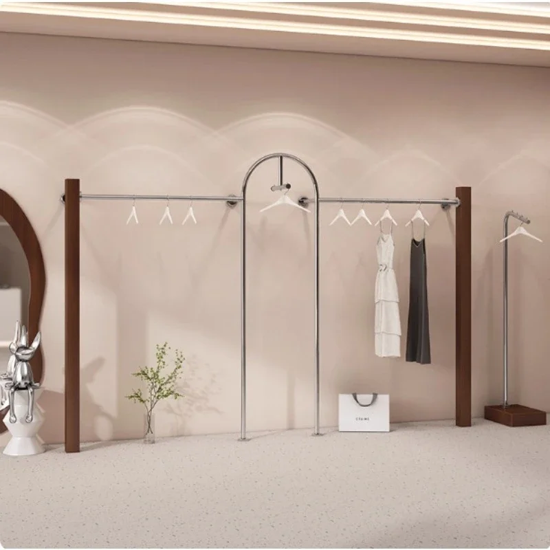 High-end clothing store display rack, stainless steel clothing rod on the wall, walnut women's clothing store anti-solid wood