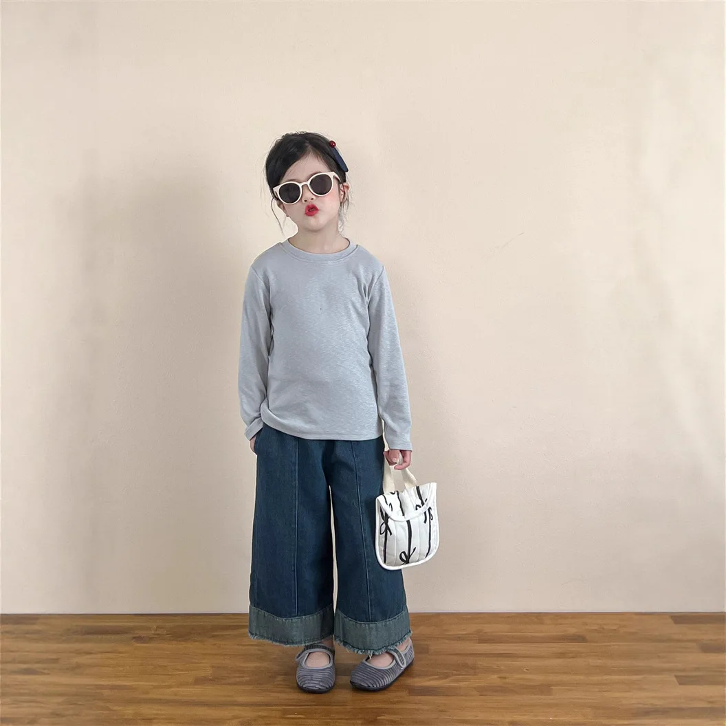 أطفال الخريف الربيع أسفل قميص 2025 جديد الكورية المألوف الفتيات الفتيان بلون طويل الأكمام بسيطة عادية اليومية تي شيرت