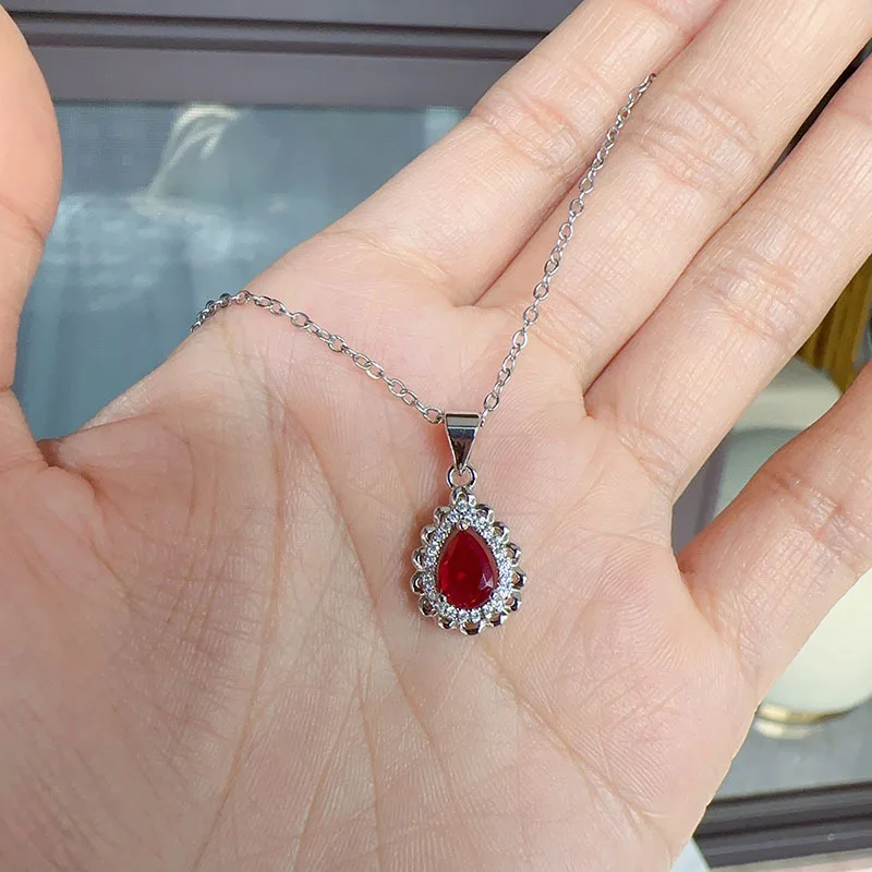 The new European and American inlay zirconium drop shape pigeon red corundum gem color treasure pendant female collarbone chain