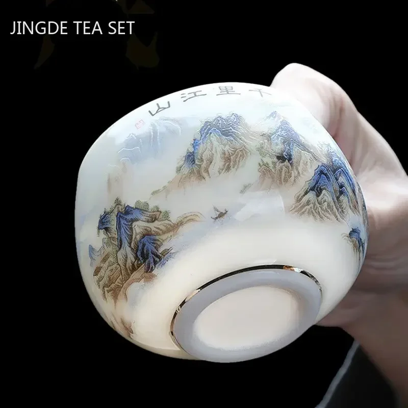 Exquisita taza de té de porcelana blanca de Jade gordo de cordero, taza de té de cerámica portátil hecha a mano, juego de té personalizado, taza