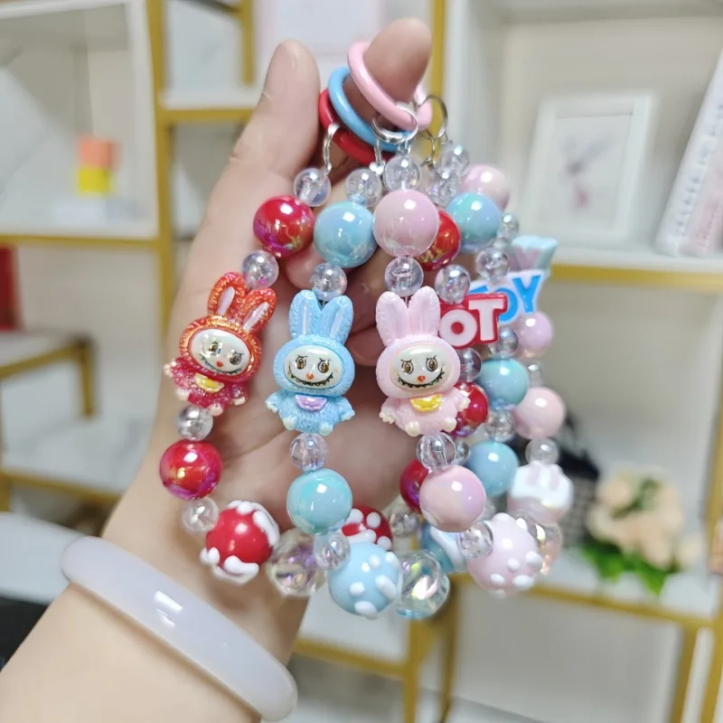 

Kawaii cartoon labubu mobile phone chain beads string beads keychain mobile phone shell hanging chain backpack pendant gift