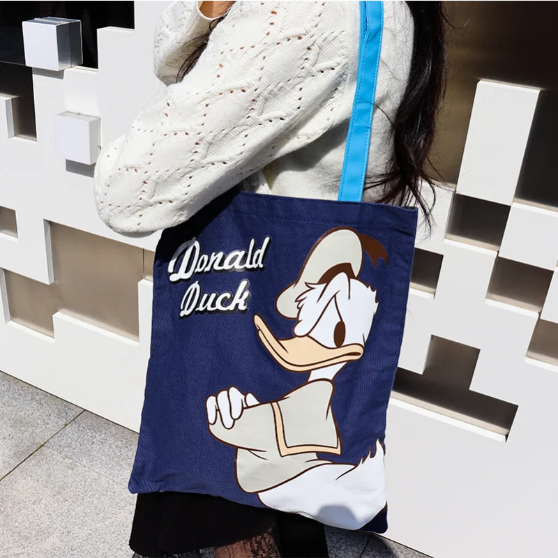 

Disney Mickey Mouse cute simple fashion handbag Donald Duck cartoon versatile portable large capacity canvas shoulder backpack