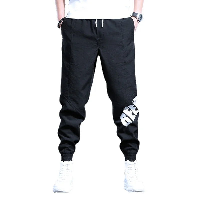 Pantalones deportivos informales para hombre, ropa de calle a la moda, con letras impresas, para correr, color negro, holgados, con cordón