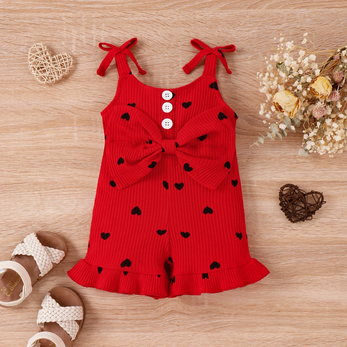 

PatPat Baby Girl Cotton Ribbed Allover Heart Print Bow Front Ruffle Trim Cami Romper