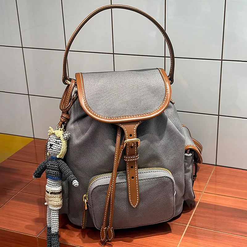 2025 new niche design miu canvas backpack retro large capacity drawstring college wind commuter handbag  