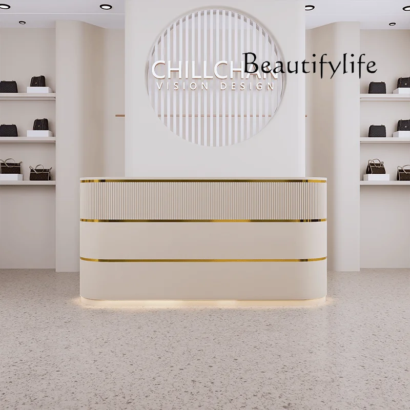 Simple modern clothing store checkout page beauty salon curved small front desk reception counter