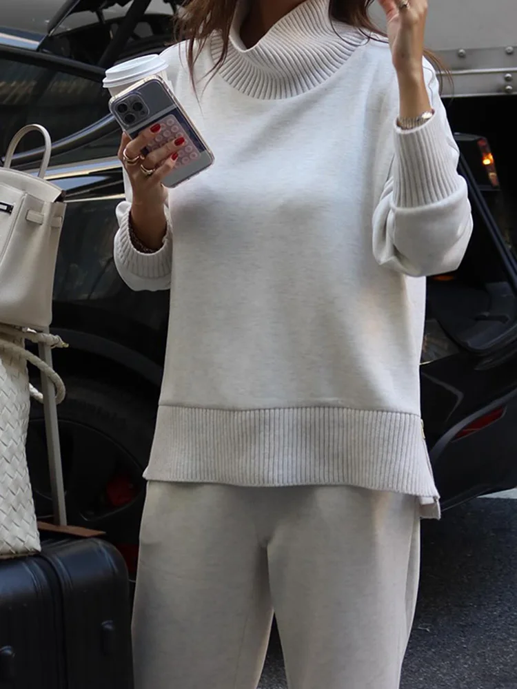 Solides zweiteiliges Damen-Set mit halbhohem Kragen, langen Ärmeln, seitlichem Reißverschluss, lockerem Pullover-Oberteil und gerader Hose, 2026 Damen-Matching-Set. – Detail 8