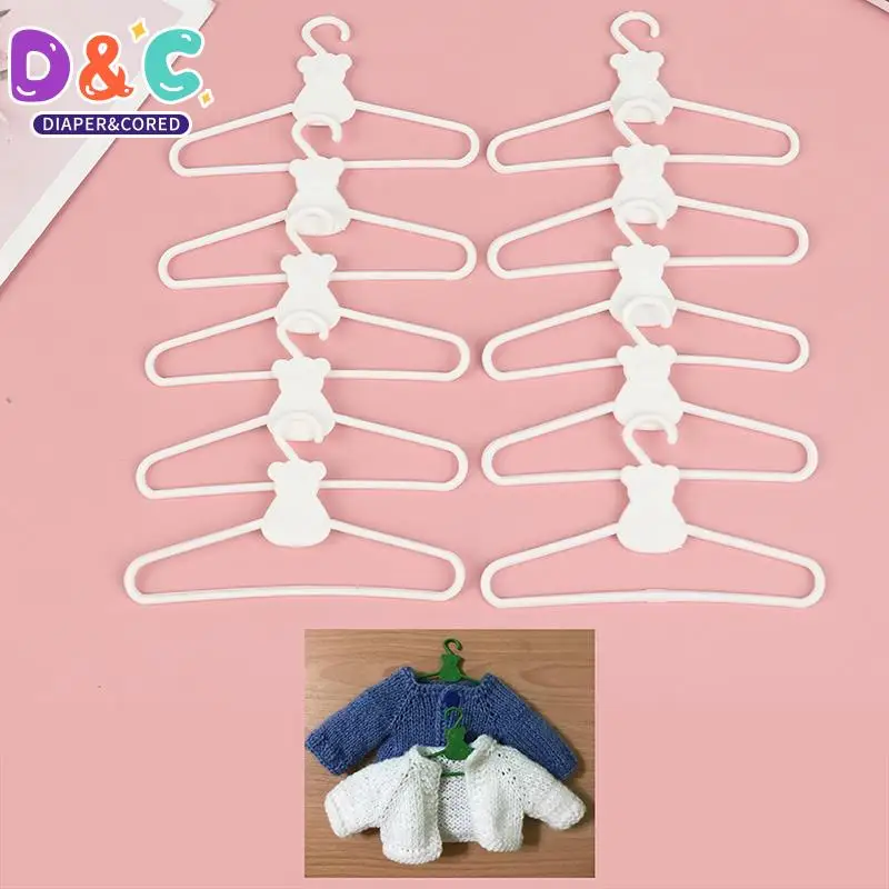 Mini cintres en plastique mignons, accessoires pour poupées, manteau, robe, robe, robe de beurre, vêtements, courses, jouet de maison, 10 pièces/lot