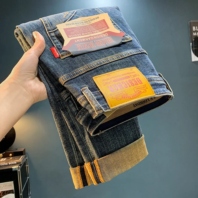 High-end retro gewassen denim jeans voor heren in noodlijdende rechte pijpen, casual ontwerp, trendy merk bedrukte slim fit broek