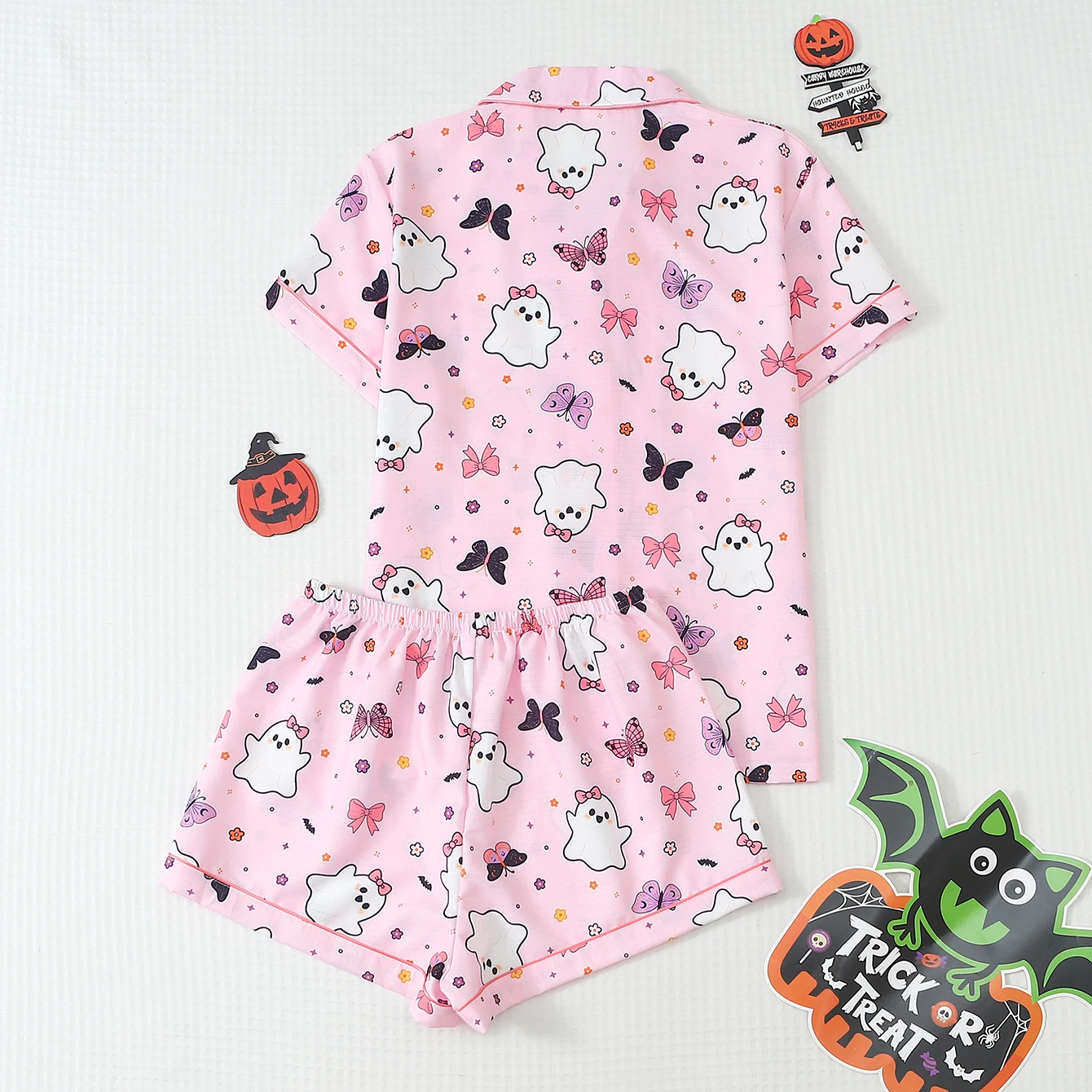 2-piece set of quirky and fun Halloween-themed pajamas with ghost, flower, and bow prints, featuring a short-sleeved, hemmed, collared top and bow shorts, suitable for women as home wear and for Halloween