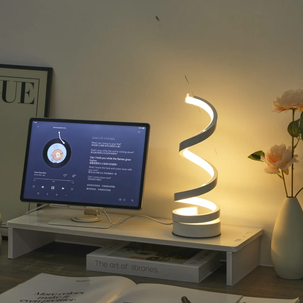 A Modern, Elegant White Spiral Desktop Lamp, Powered by USB with Three-Color Dimming, Suitable for Various Types of Rooms.