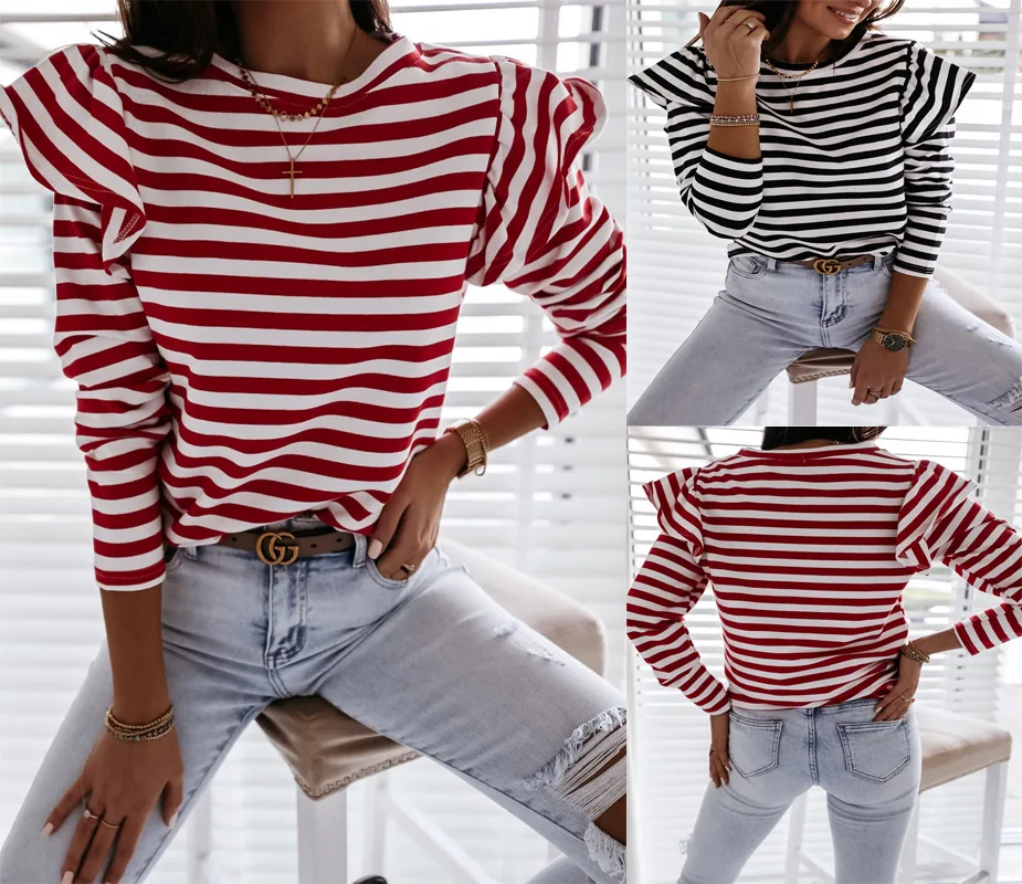 Damska bluzka w czerwono-białe paski z bufiastymi rękawami, okrągłym dekoltem, długim rękawem i luźnym krojem.