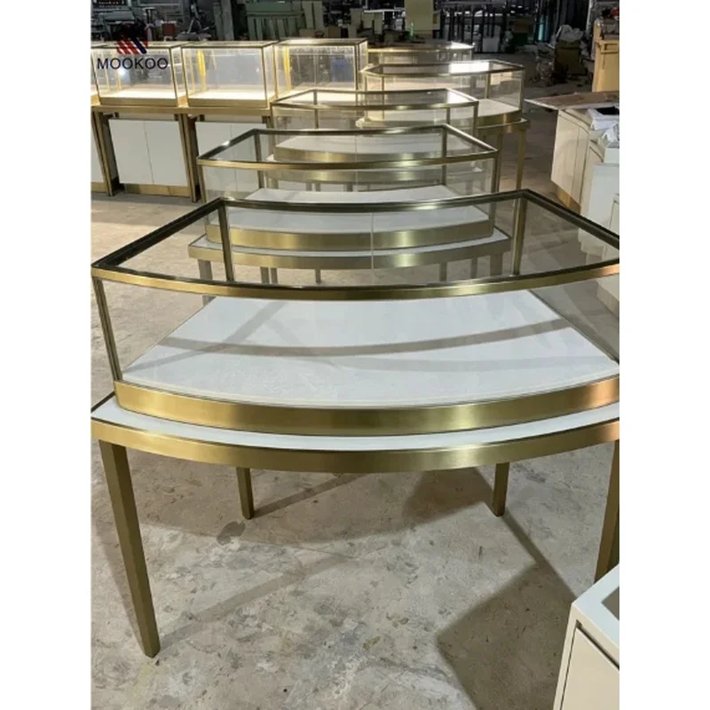 custom.Custom Curved Glass Jewelry Display Counter Brushed Golden Stainless Steel Frame High Leg Jewellery Shop Showcase