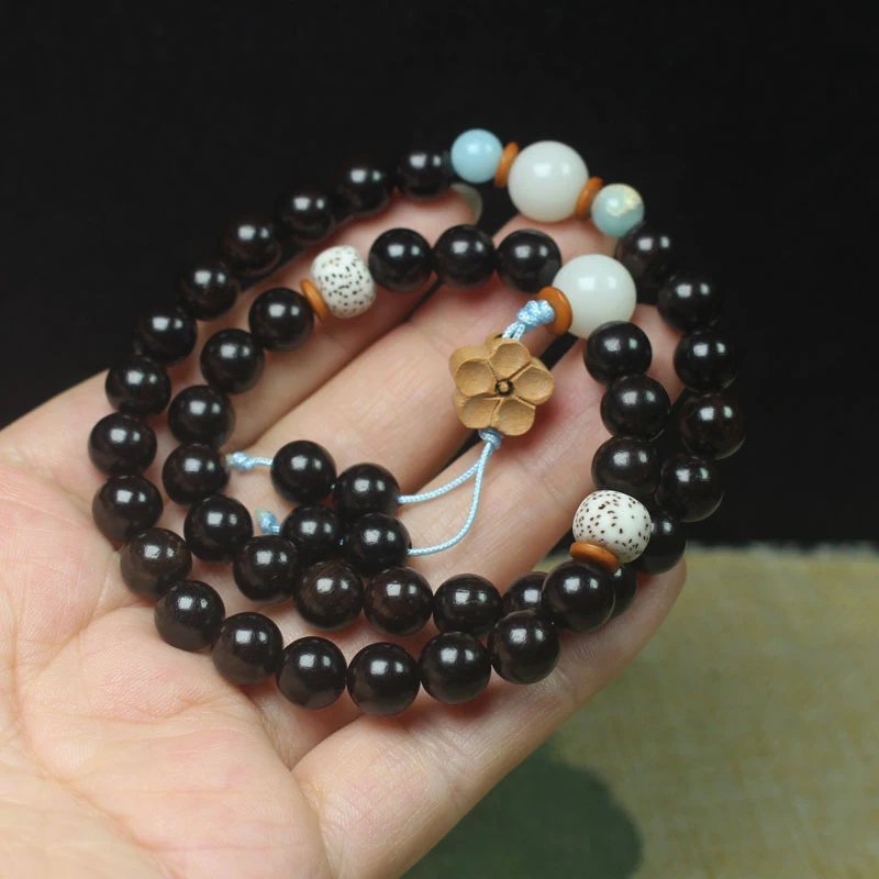 Ebony 8mm double-loop bracelet with star, moon, and small flower beads, simple Buddhist prayer beads, and decorative accessory