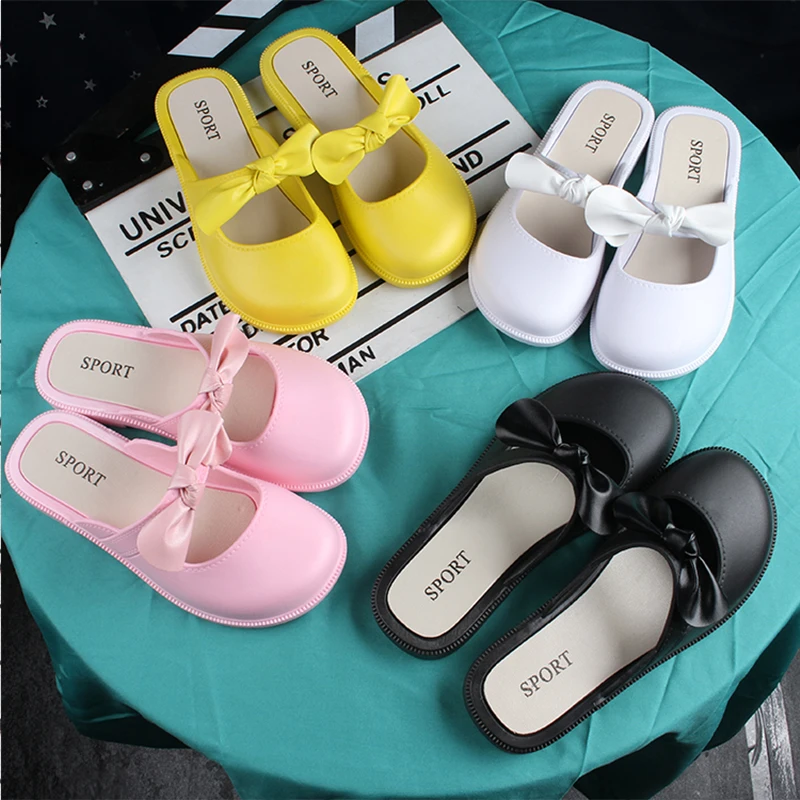 Children\'s New Summer PVC Little Girl Fashion Outside Wearing Solid Color Bow Half Drag Flat Sandals