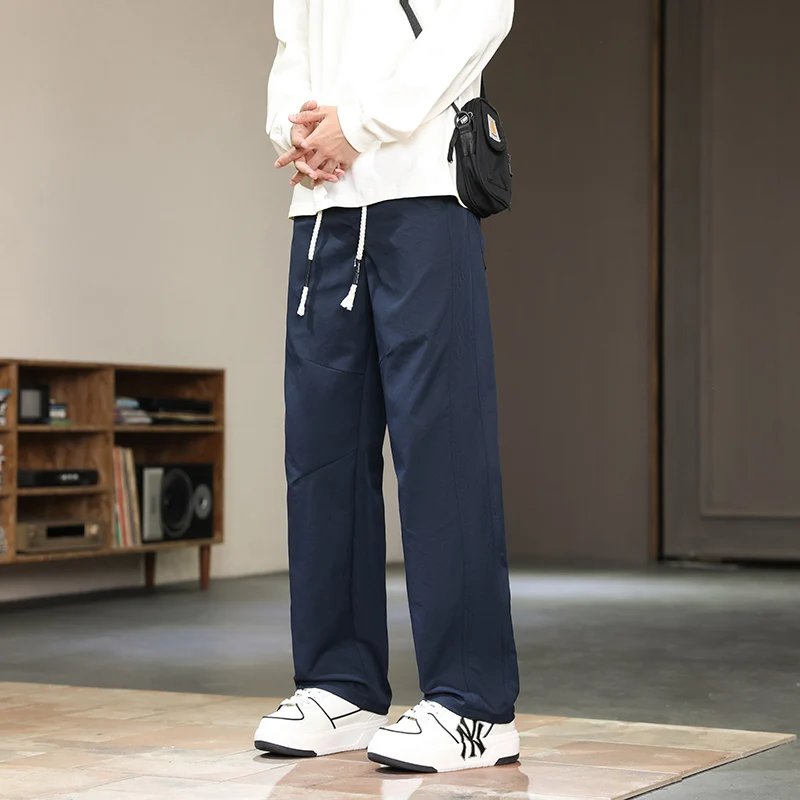 Pantalones de pierna ancha curvados de poliéster para hombre, Pantalones rectos cómodos y versátiles con diseño de cordón, Otoño e Invierno 2025, talla grande 5XL