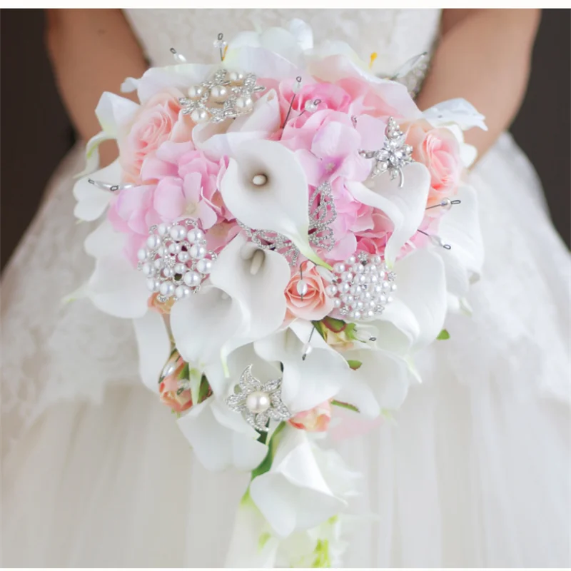 

bridal calla lilies holding flowers wedding bride holding flowers white calla lilies roses water drops holding bouquet