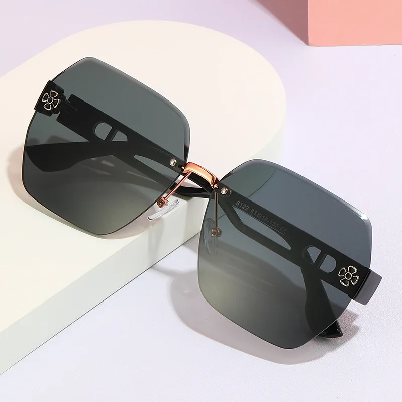 Polygonal frameless metal middle beam sunglasses high-end four-leaf clover hollow trimmed lenses fashion sunglasses