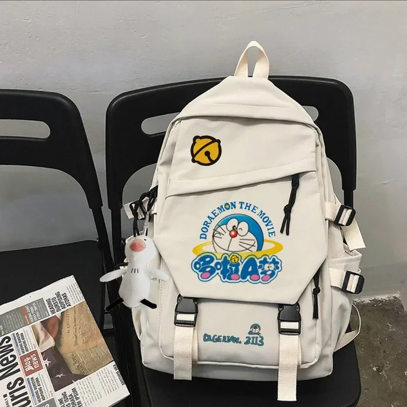 

Doraemon cartoon backpack anime cute women men boy girl nylon schoolbag student children backpack 28x45x14cm