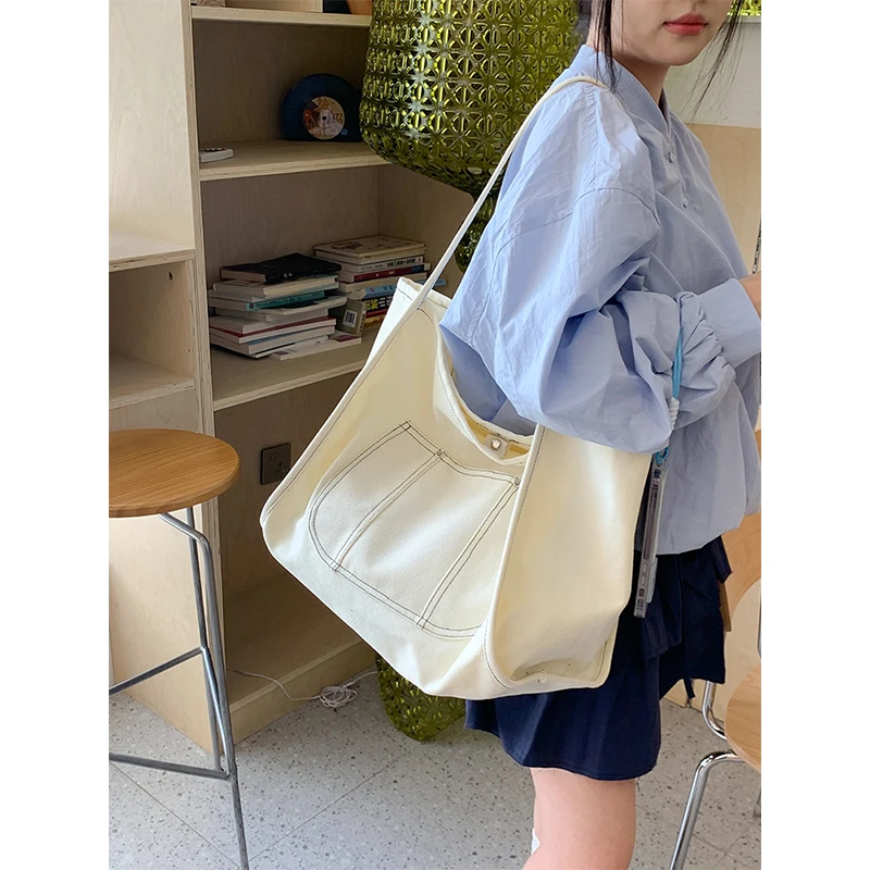 

2025 new simple large capacity canvas bag fashionable all-match solid color shoulder bag Korean lazy style commuter shoulder bag