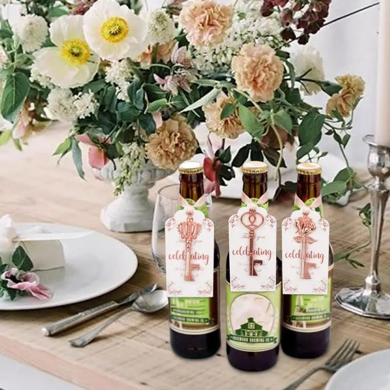 กุญแจเปิดขวดสําหรับผู้เข้าพัก Rose Gold Baby Shower โปรดปรานสําหรับผู้เข้าพัก Key ที่เปิดขวดพร้อม Escort Tag การ์ดและพวงกุญแจสําหรับ