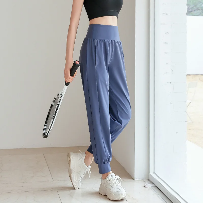 กางเกงโยคะผู้หญิง ฤดูใบไม้ผลิ ฤดูร้อน รุ่นใหม่ เอวสูง ทรงหลวม สำหรับวิ่งกลางแจ้ง กางเกงจ็อกเกอร์พิเศษ ฟิตเนส แห้งเร็ว สวมใส่สบาย กางเกงขายาว