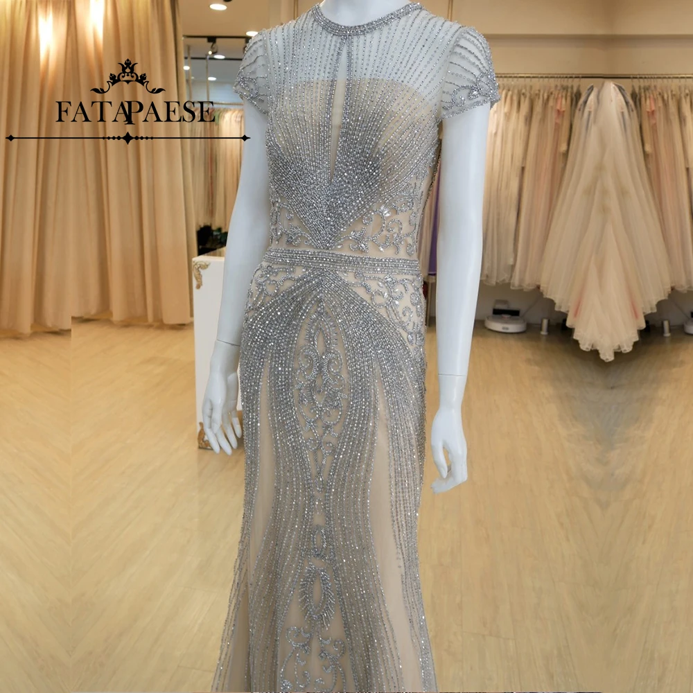 

FATAPAESE Stunning Evening Dress full length design that features an intricate beaded design throughout covered plunging neck