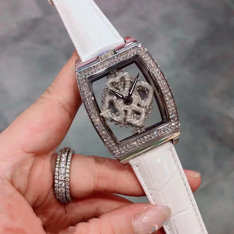 High Quality Luxury Quartz Watch with Rhinestone Spinning Diamond Face Fashion White Leather Tonneau Skeleton Watches for Women