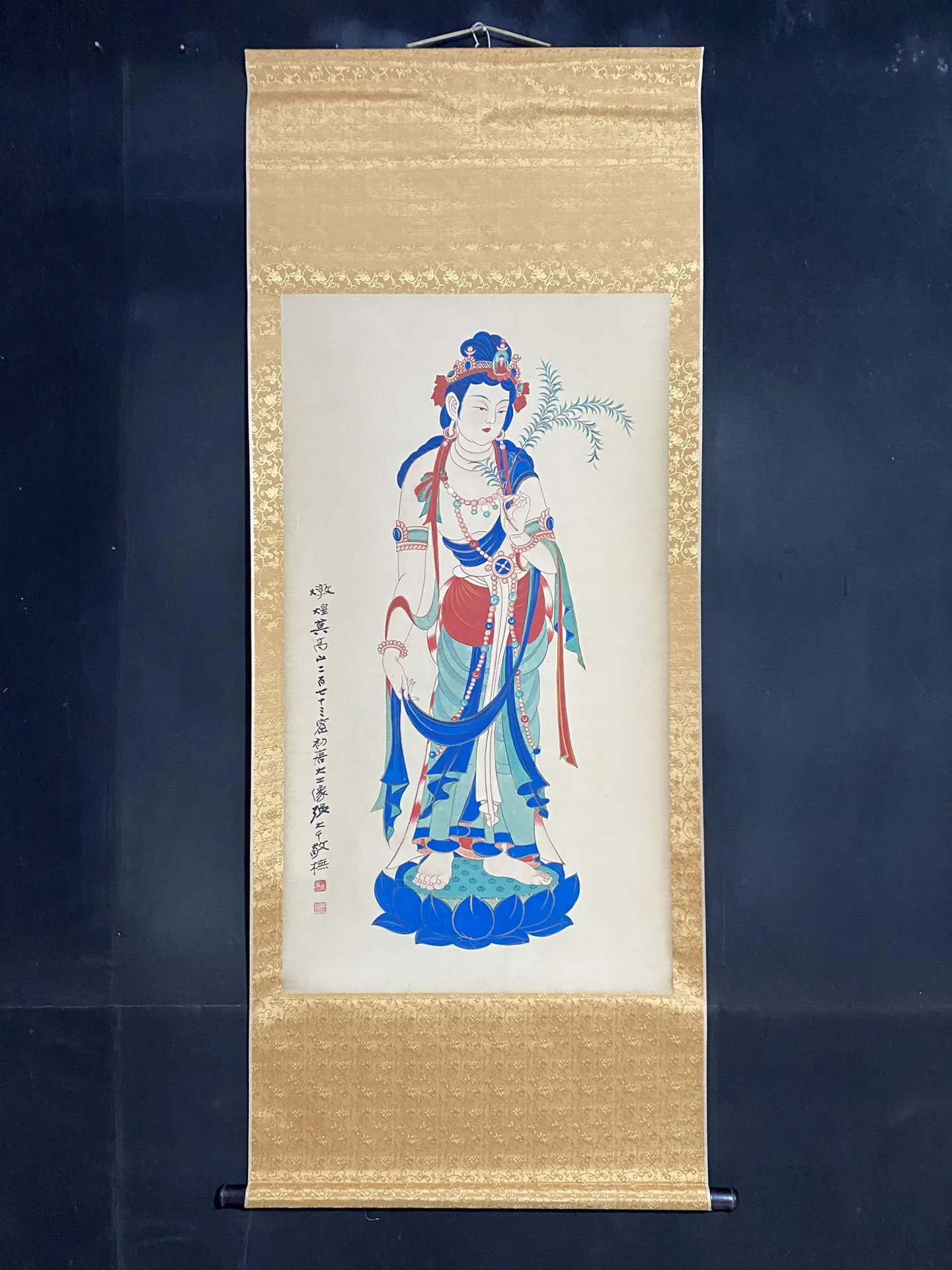 

A four-foot anti-counterfeiting zhongtang painting by Zhang Daqian titled 'Great Tang Buddha'. The image is a real photo. The ma