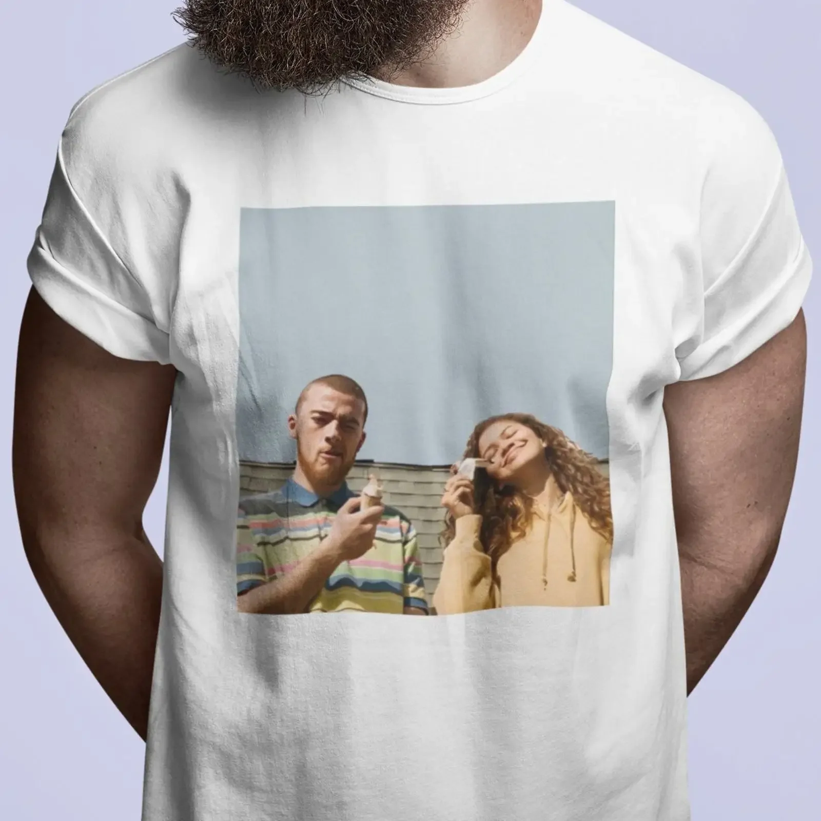 May include White t shirt with a printed image of two people holding ice cream cones The is in light blue frame vintage Washed