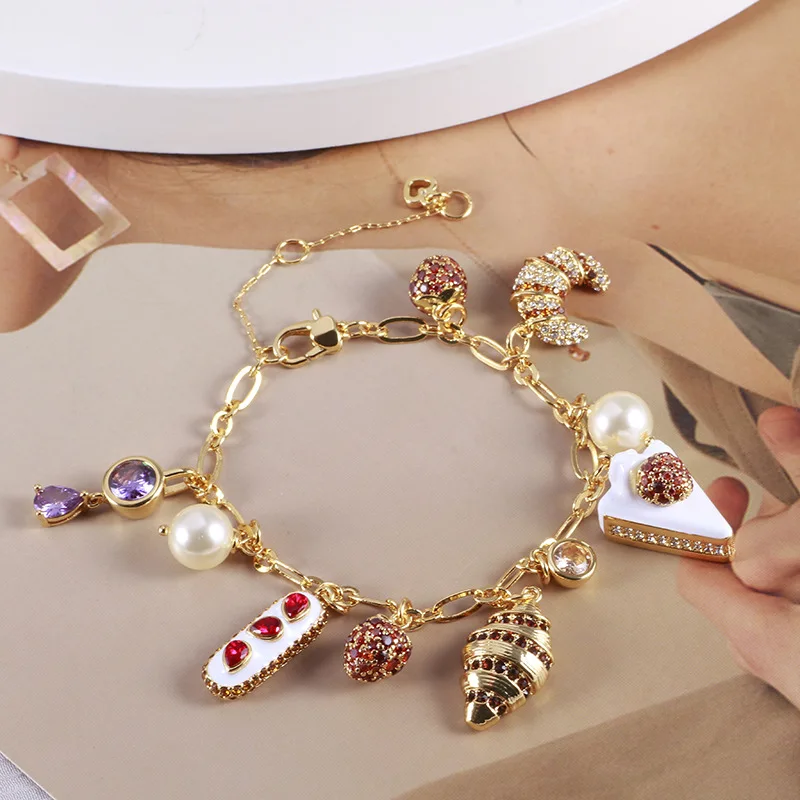 

Classic Handmade Enamel Three-dimensional Strawberry Cake Horn Croissant Bread Paved Inlaid Pearl Zircon Multi-pendant Bracelet