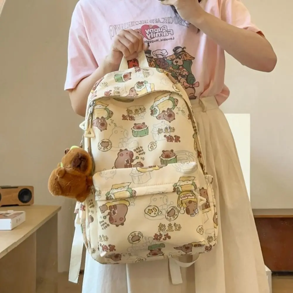 Mochila Capybara de gran capacidad para niños, bolso de hombro de dibujos animados de animales de estilo coreano con colgante, bolso escolar