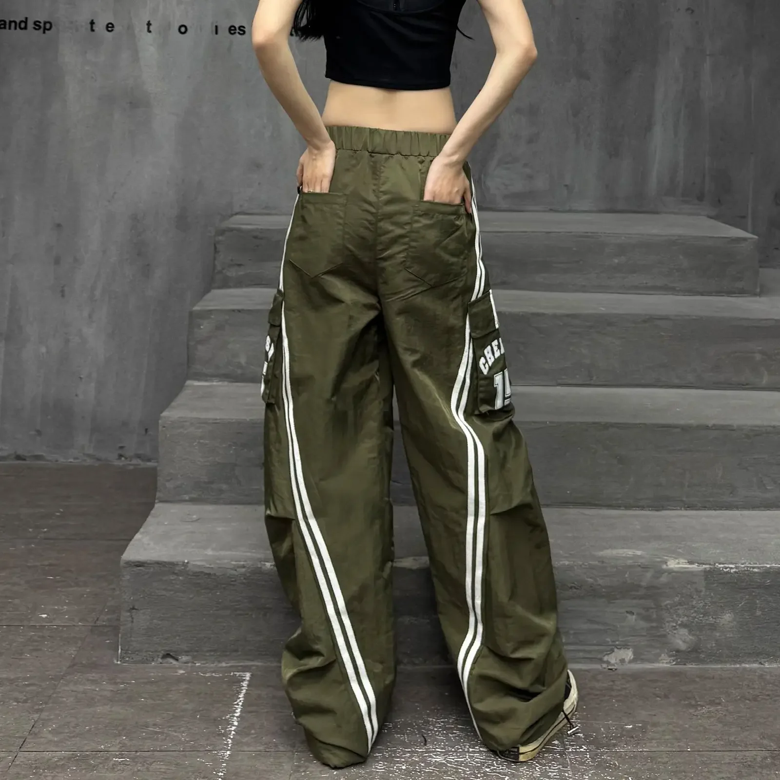 الهيب هوب الربط بنطال ذو قصة أرجل واسعة للنساء في ربيع 2025 جديد شارع العليا التخسيس فضفاض السراويل الكلمة غير رسمية الملابس النسائية