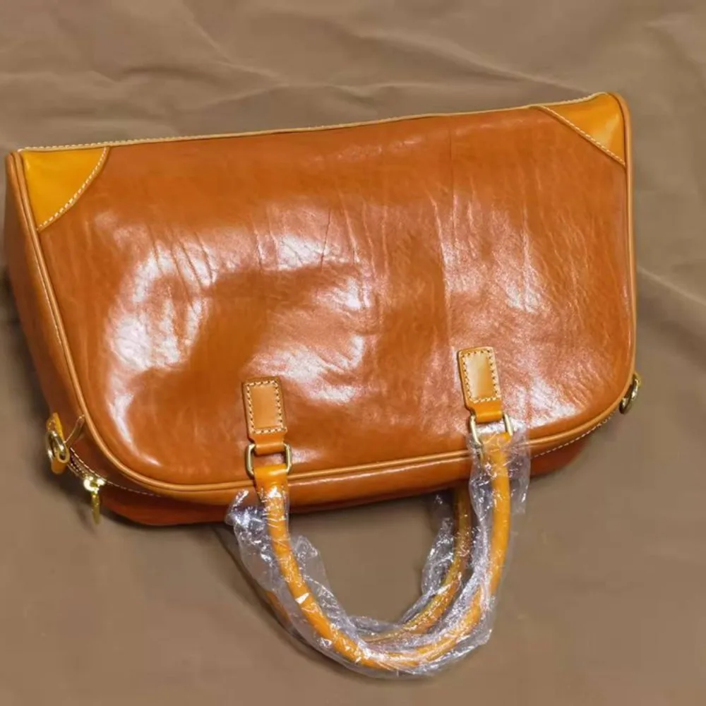 

New Retro Vegetable Tanned Leather Large-capacity Men's Women's Portable Travel Fashionable Burst Cowhide Crossbody Travel Bags