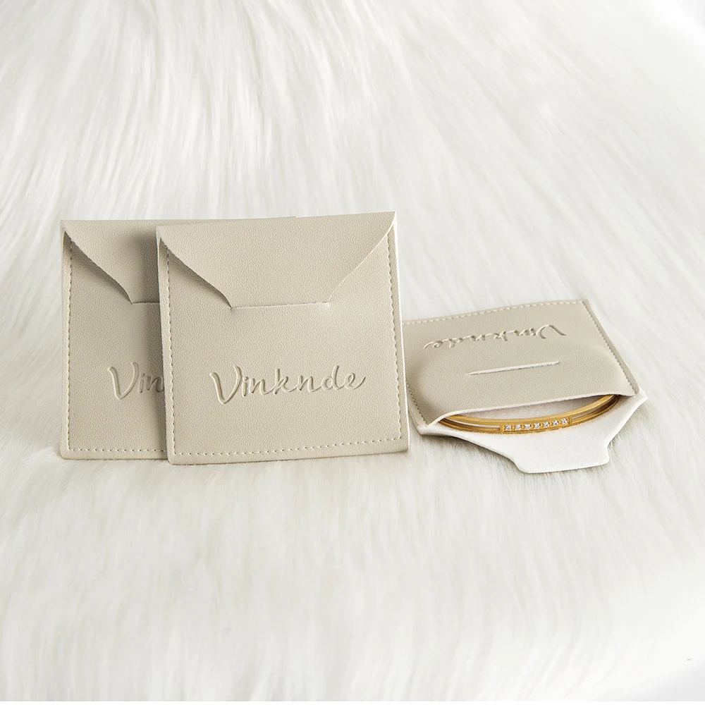 

Персонализированный логотип, 100 шт./лот, ювелирные изделия, сумка из искусственной кожи 12x12 см, конверт для ювелирных изделий, мешочки для конфет для колец, серег, браслета, подвески