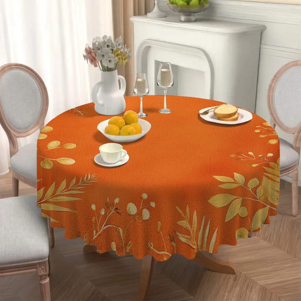 One autumn-themed circular tablecloth with a golden leaf pattern, perfect for enhancing the circular shape.zyc