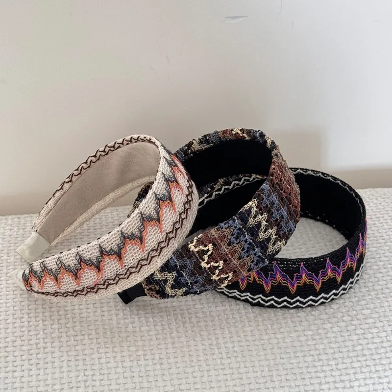 

Bohemian vacation style hollow linen knitted woven headband women's niche design sense high cranial top disc hair headband