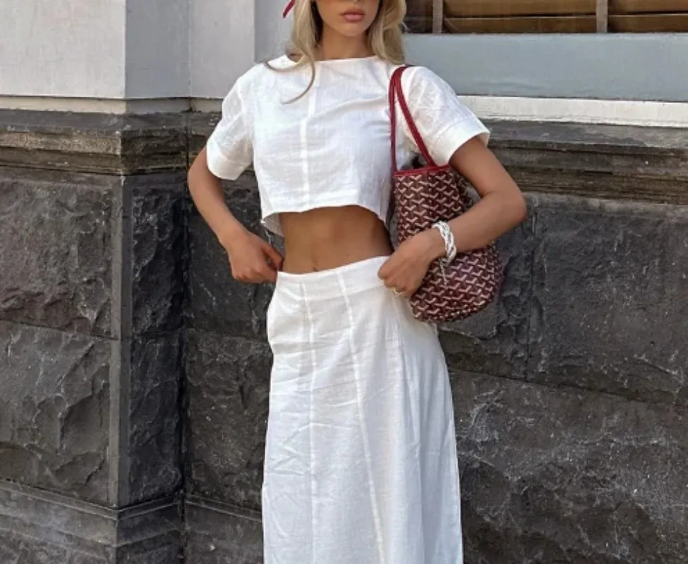 

Лето 2025 г., модный новый новейший хит продаж, комплект из двух предметов для женщин, белый хлопок и лен, укороченный топ с круглым вырезом, длинная юбка, комплект